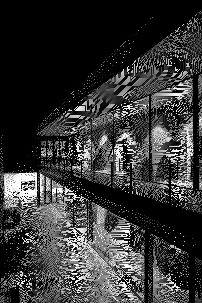 outside looking installation view (portugal) at night: Wall painting with nine big red ovals (also refered to as pills) that looks as if they had fall into place between the architectura on a green background with a text in the bottom sayin 'explore heavn now' in black lower-case lattering