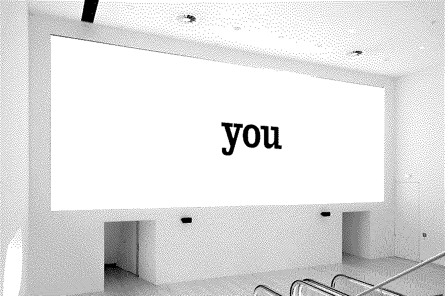 Installation view: white screen with the word 'you' in black lower-case letters.